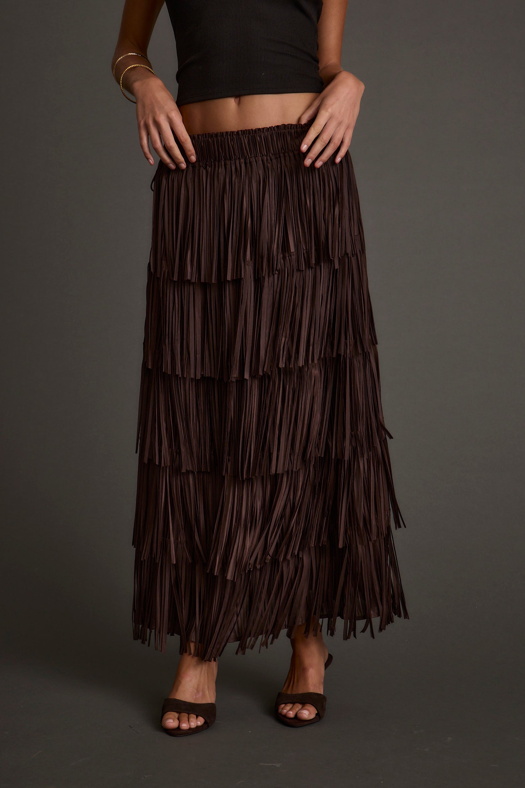 Back view of the espresso fringe maxi skirt showing the silhouette and fit.