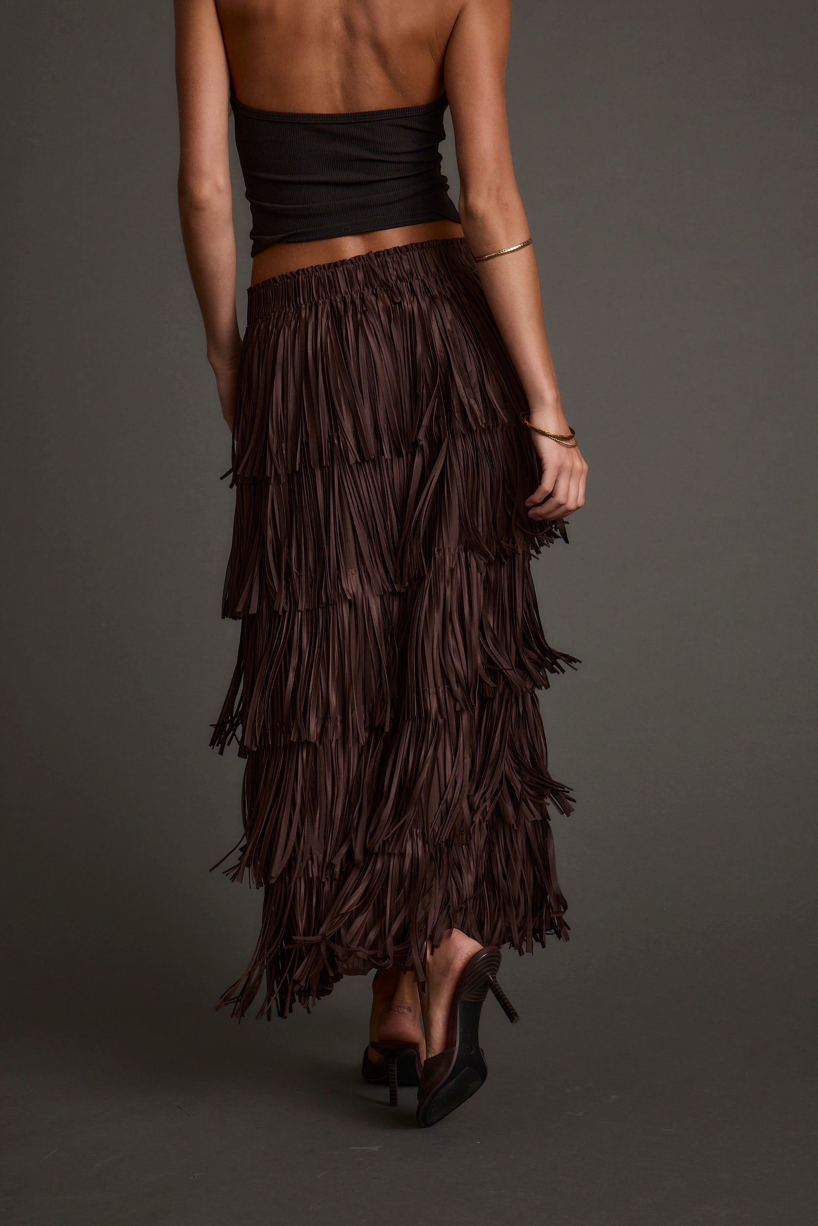 Close-up of the Eliza Espresso Fringe Maxi Skirt showcasing the fringe texture and craftsmanship.