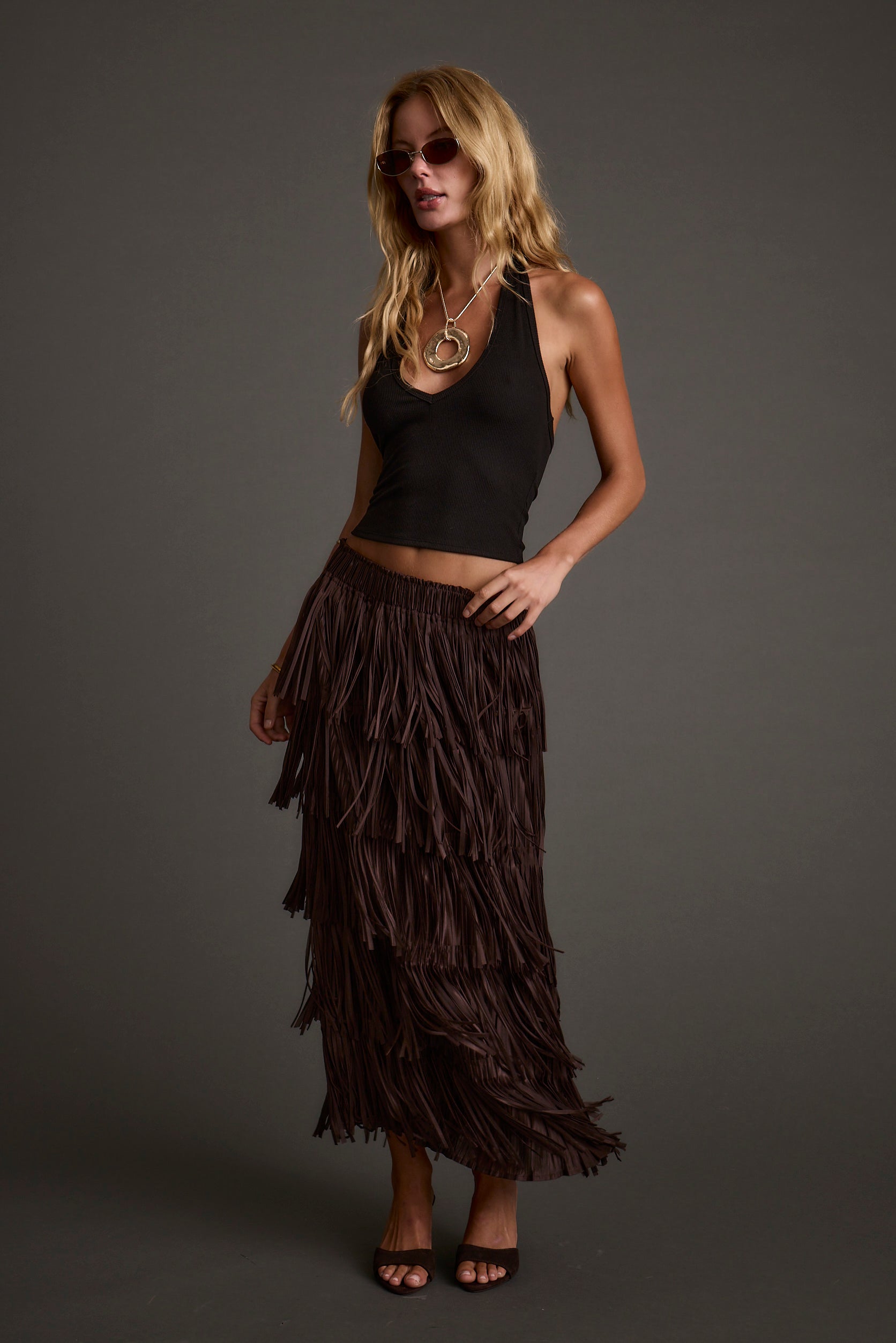 Espresso fringe maxi skirt with refined detailing and a flattering silhouette.