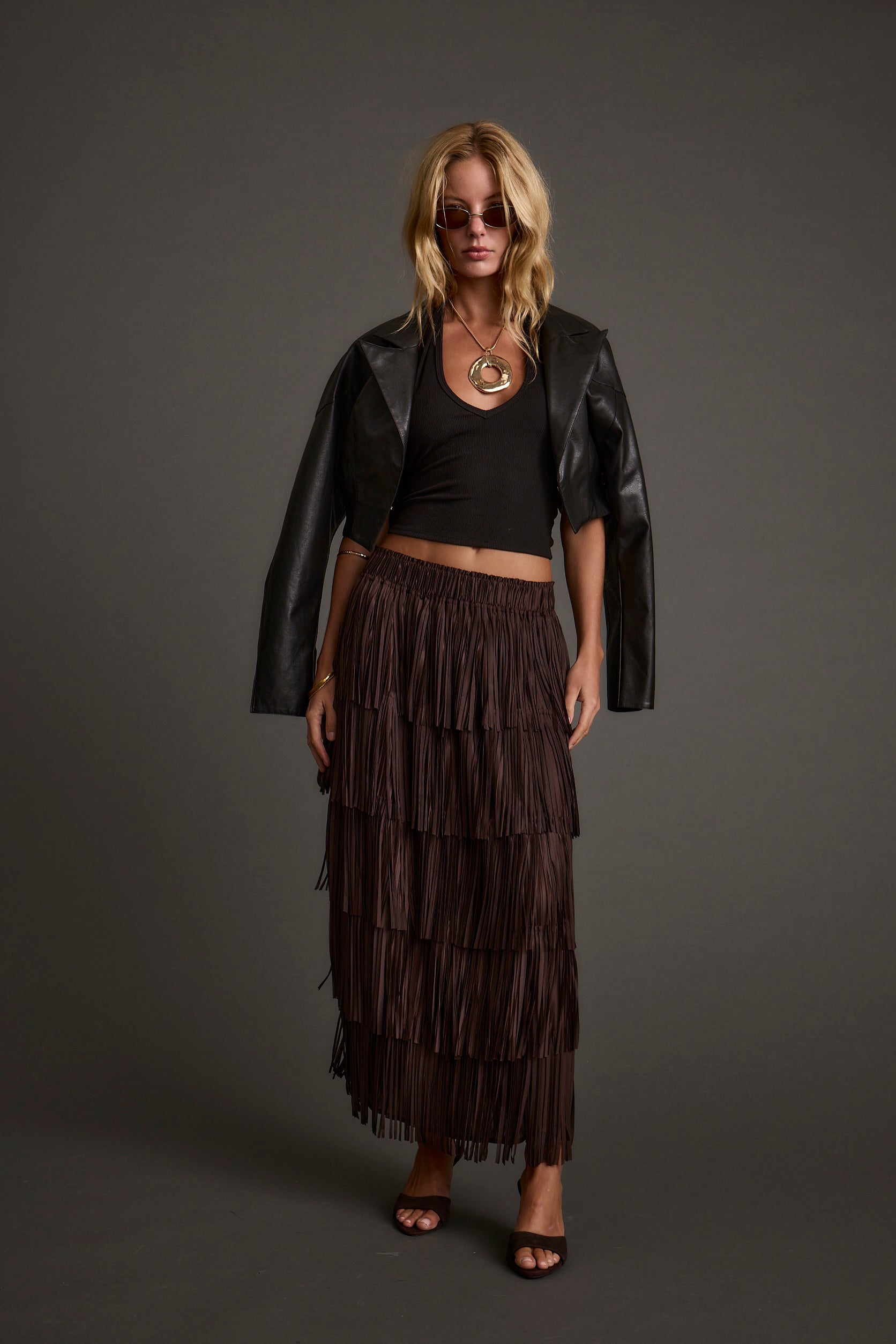 Full-length view of the espresso maxi skirt showing the drape and movement.