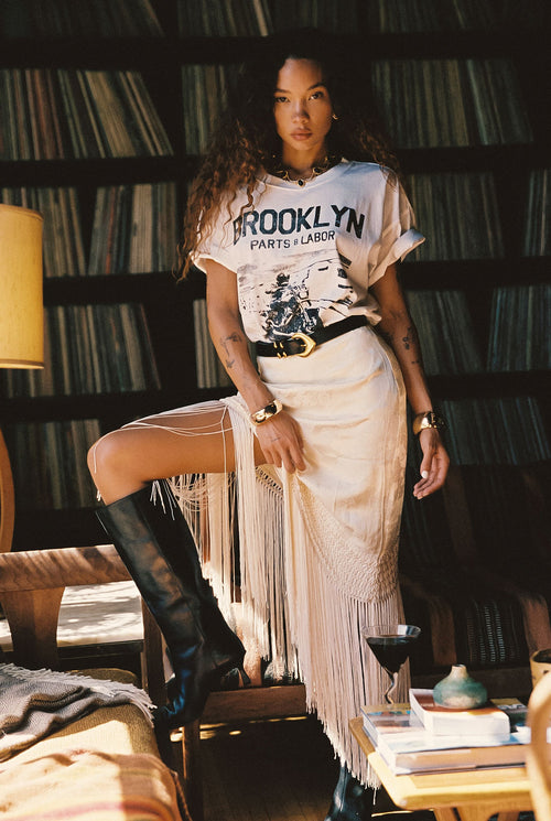 Cream fringe and satin midi skirt with refined detailing and a flattering silhouette.