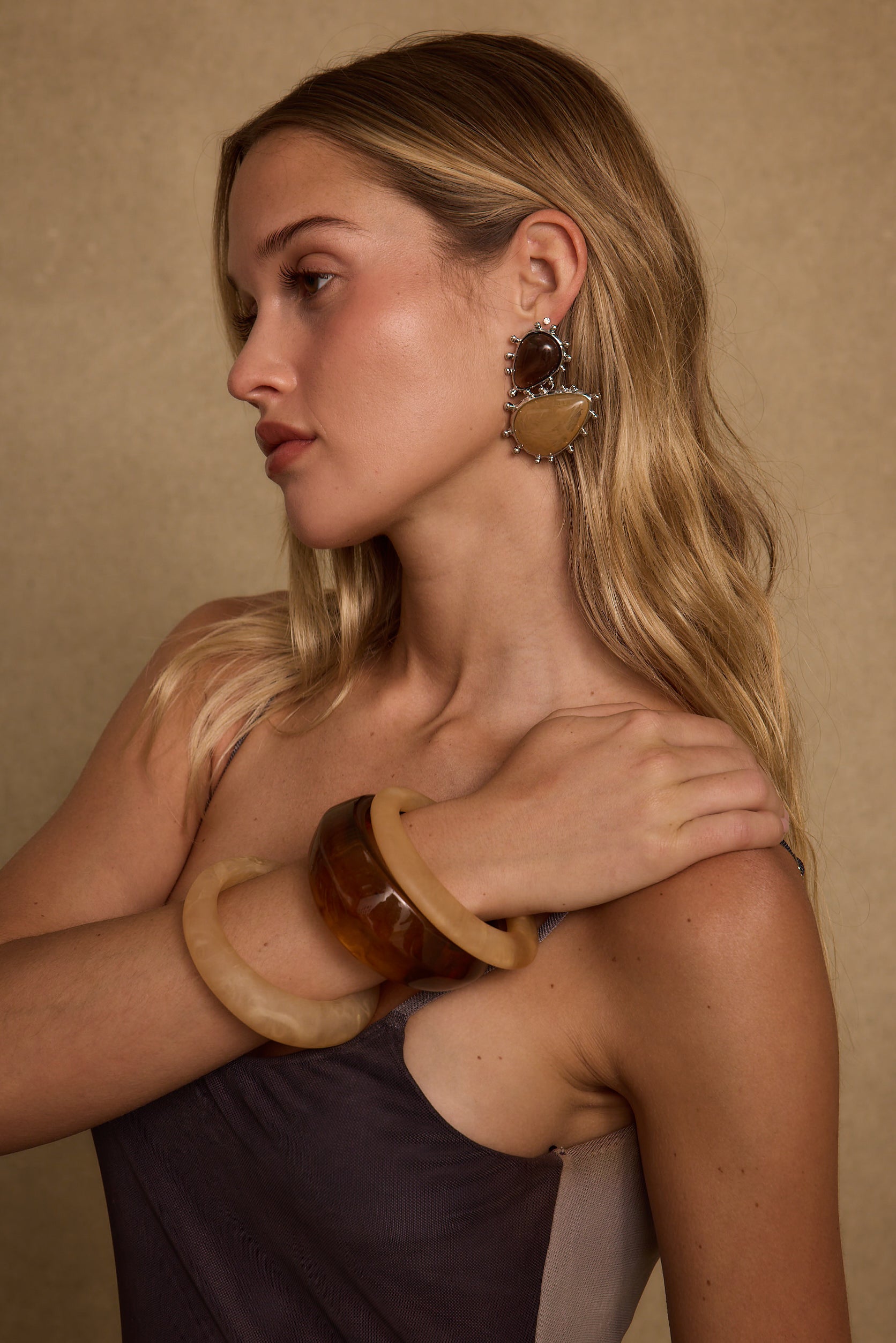 Fauna Gold and Stone Statement Earrings styled in a complete look from an alternate angle.
