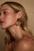 Gold earrings with refined detailing and an elegant finish.