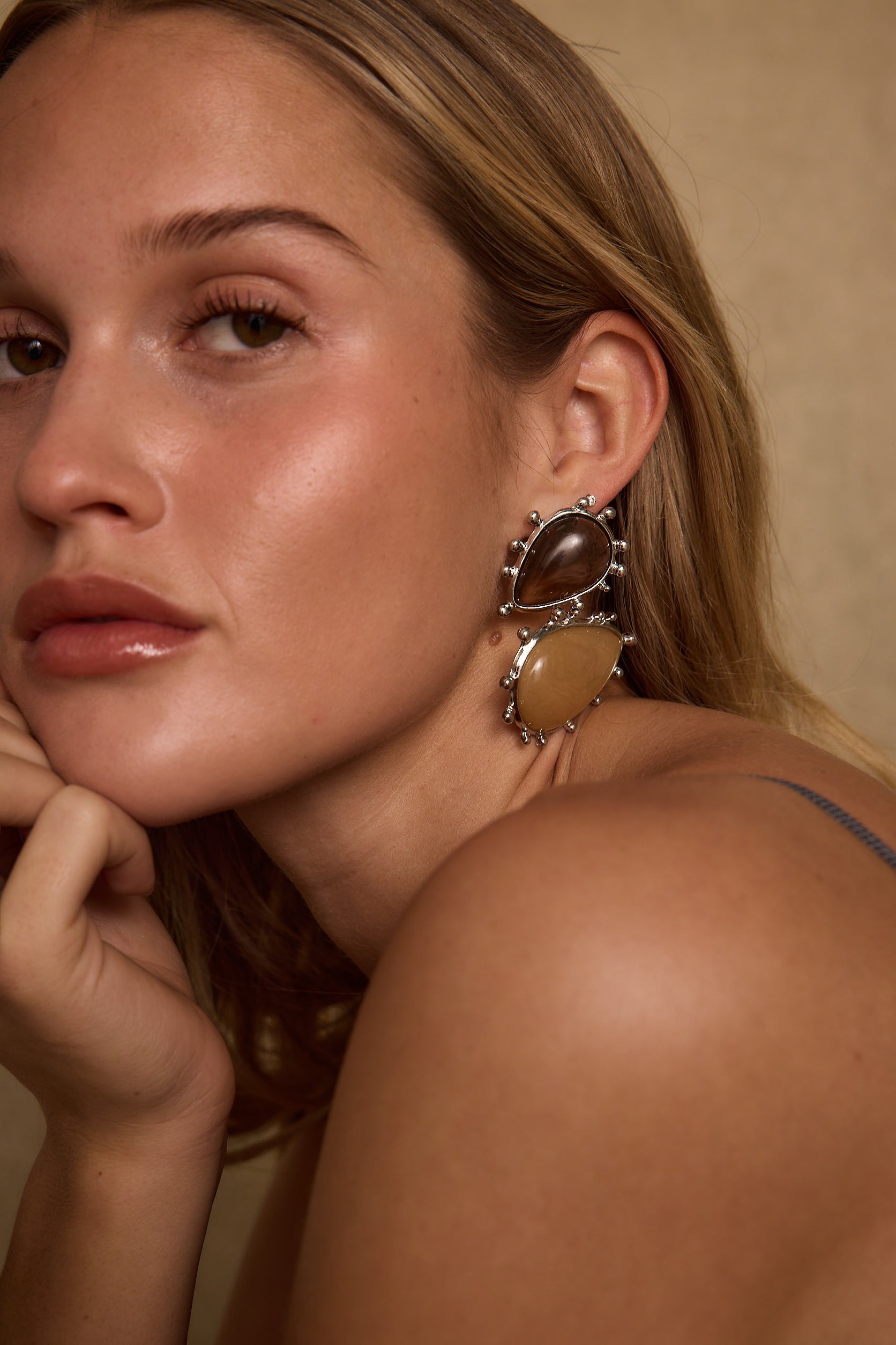 Fauna Gold and Stone Statement Earrings shown from a different angle, highlighting the metalwork details.