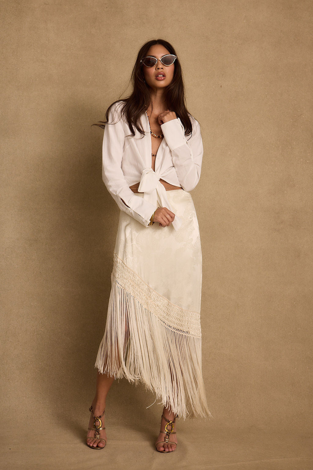 Back view of the white top showing the silhouette and fit.