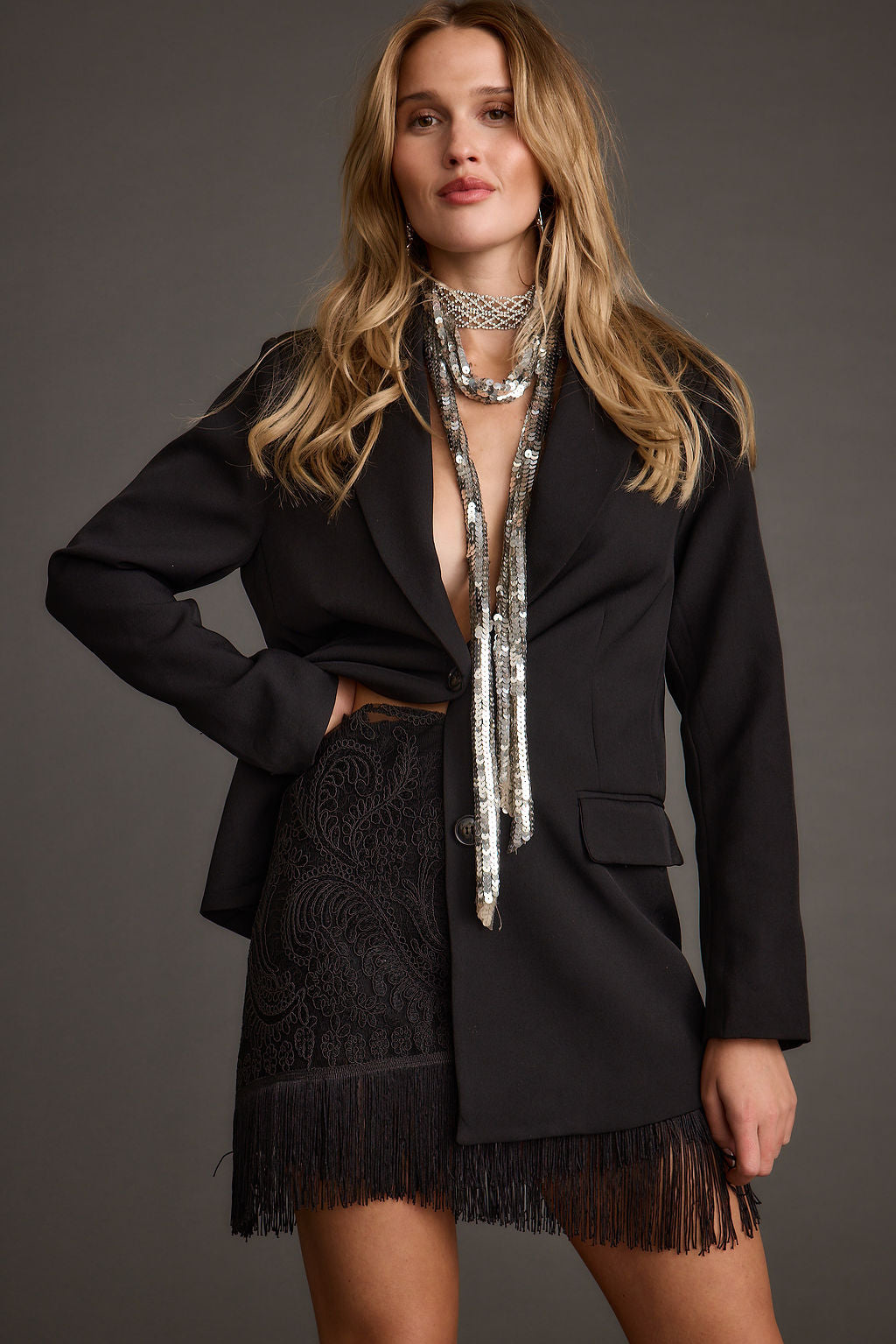 Detail shot of the Gracelyn Black Fringe Mini Skirt highlighting the fringe elements.