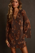 Plisse mini dress in mocha floral with deep V neckline and bell sleeves, gold pendant