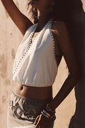 White halter halter top with elegant accents, a satin halter top essential.