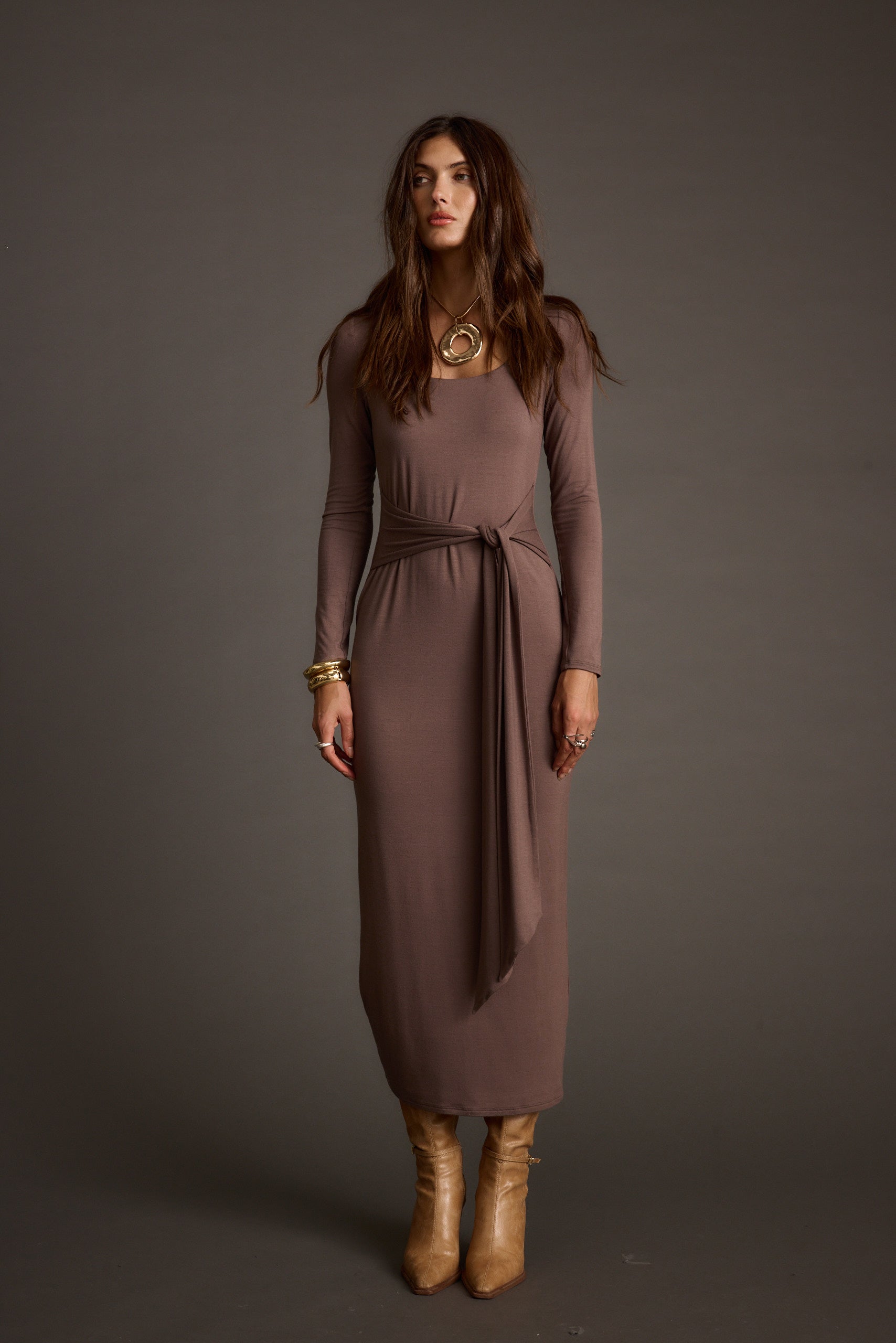 Giavana Dark Taupe Maxi Dress paired with complementary accessories for a polished look.