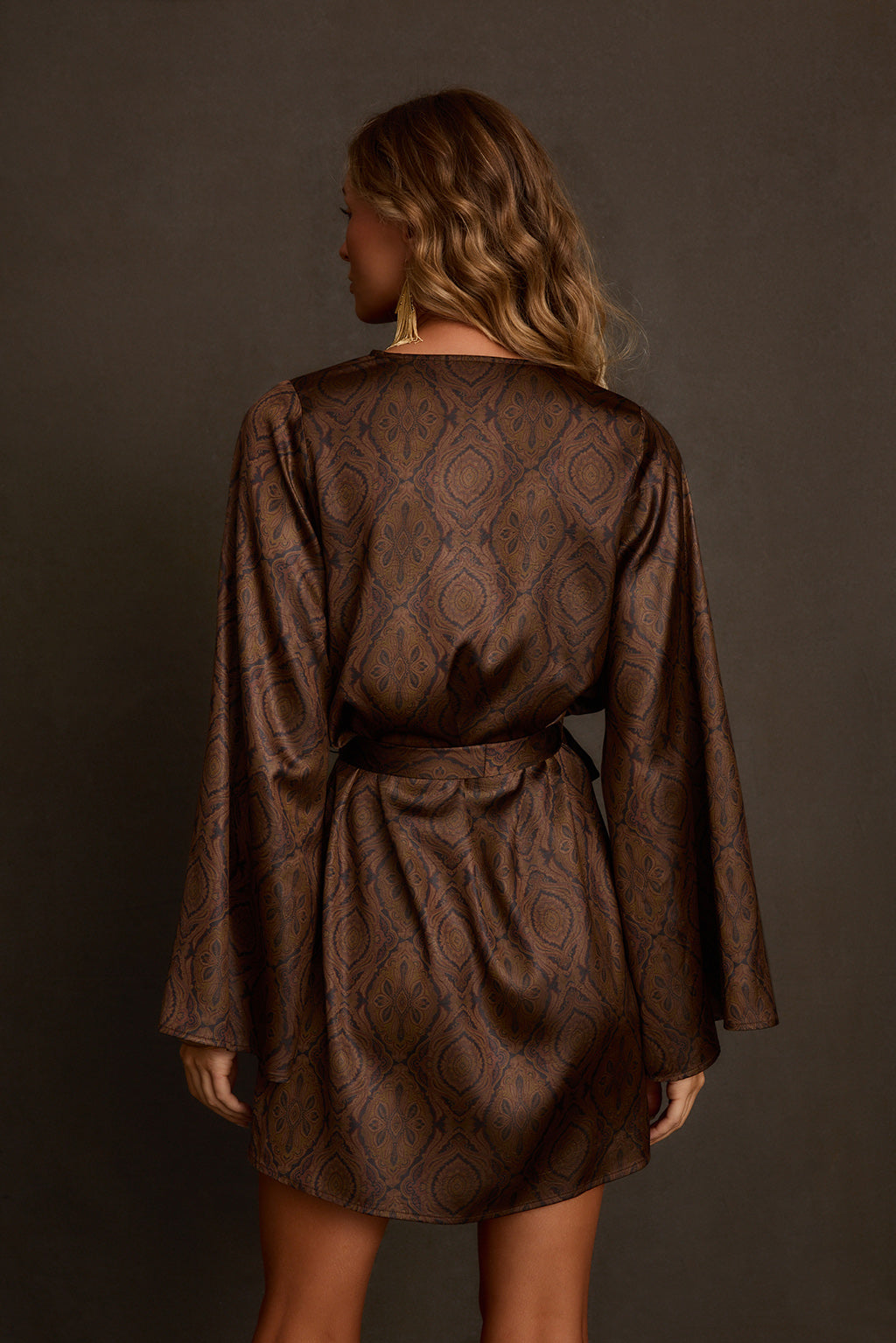 Fall dress back view with self-tie waist sash and relaxed bell sleeves