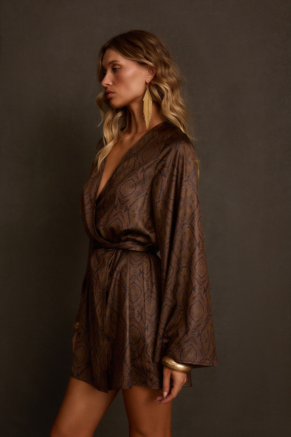 Satin kimono dress side profile showing bell sleeve drape and wrap silhouette