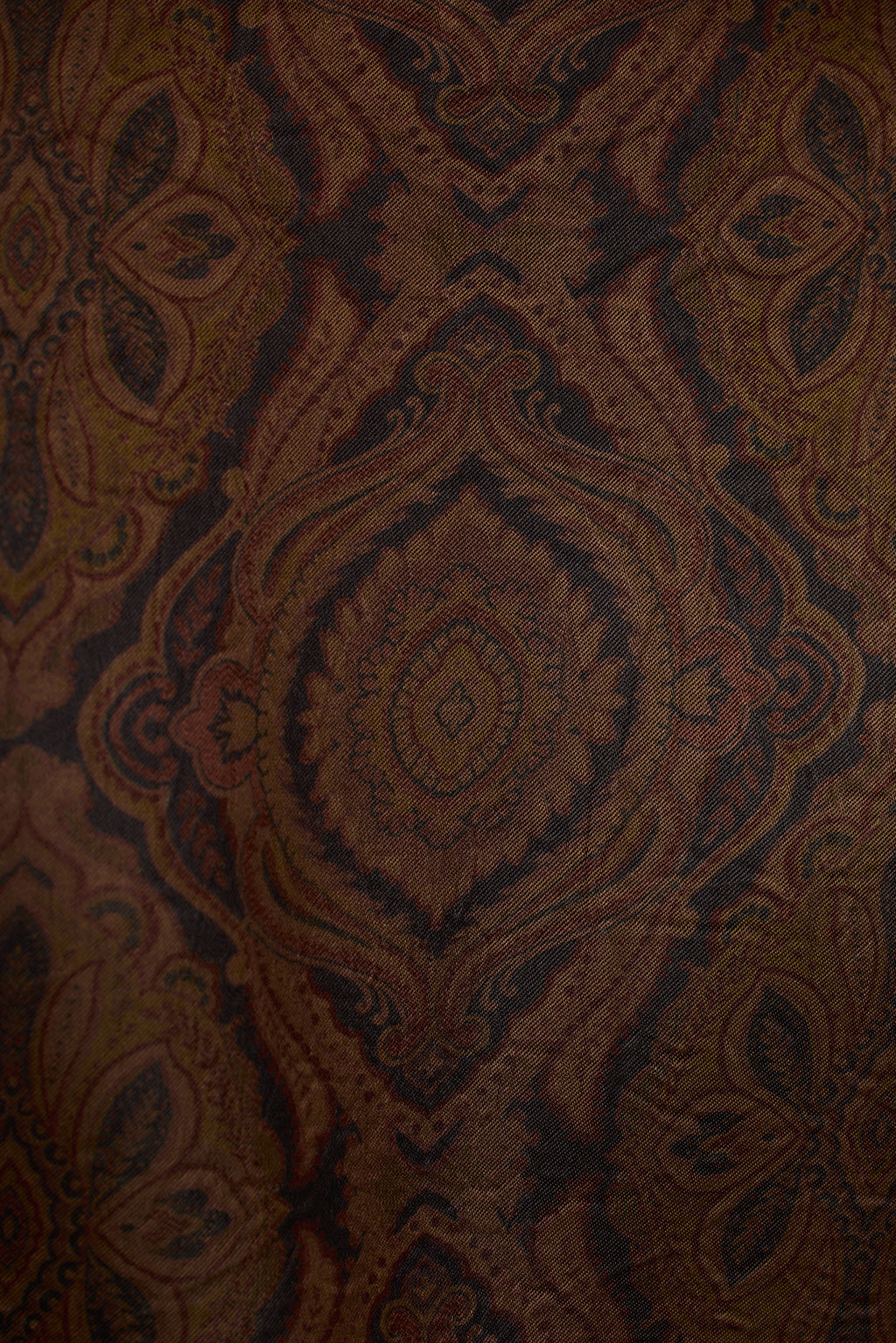 Mocha satin fabric detail showing medallion paisley print texture close-up