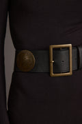 Black belt with refined detailing and a flattering silhouette.