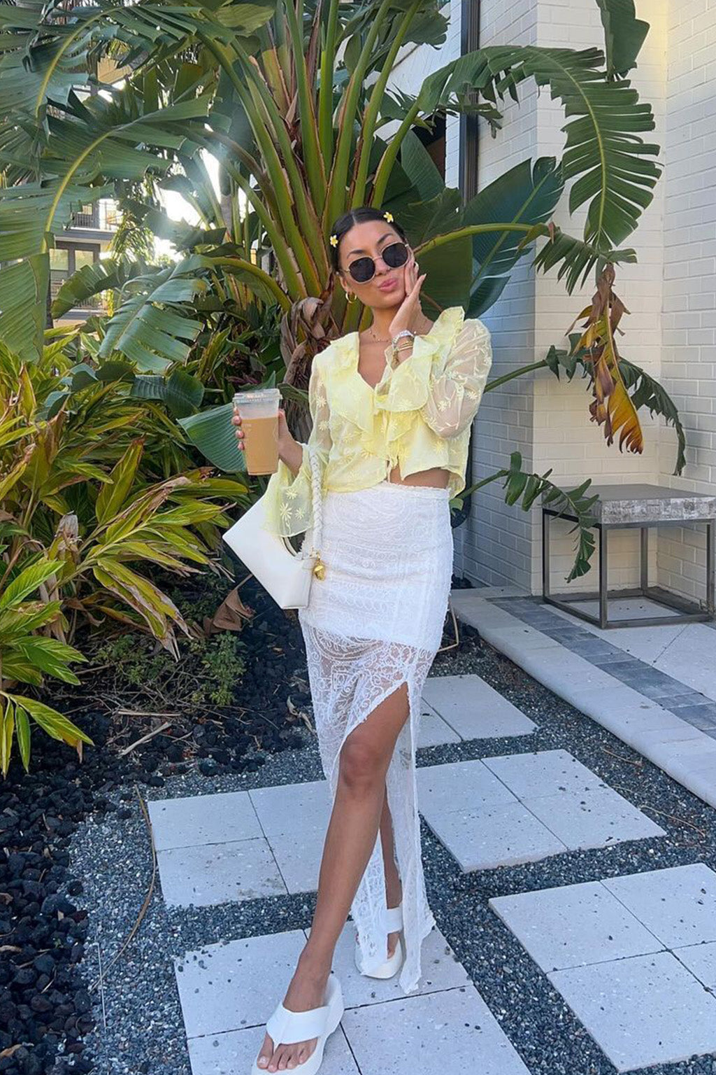 Back view of the yellow blouse showing the silhouette and fit.