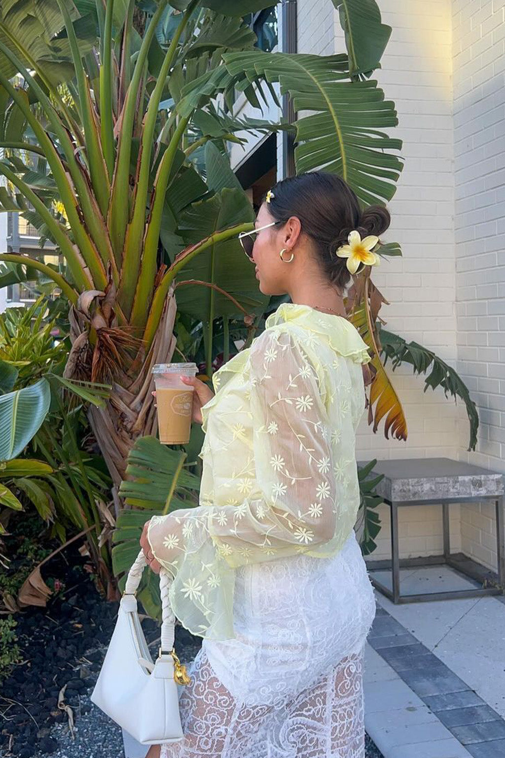 Close-up of the Guilliana Yellow Ruffle Blouse showcasing the fabric texture and design details.