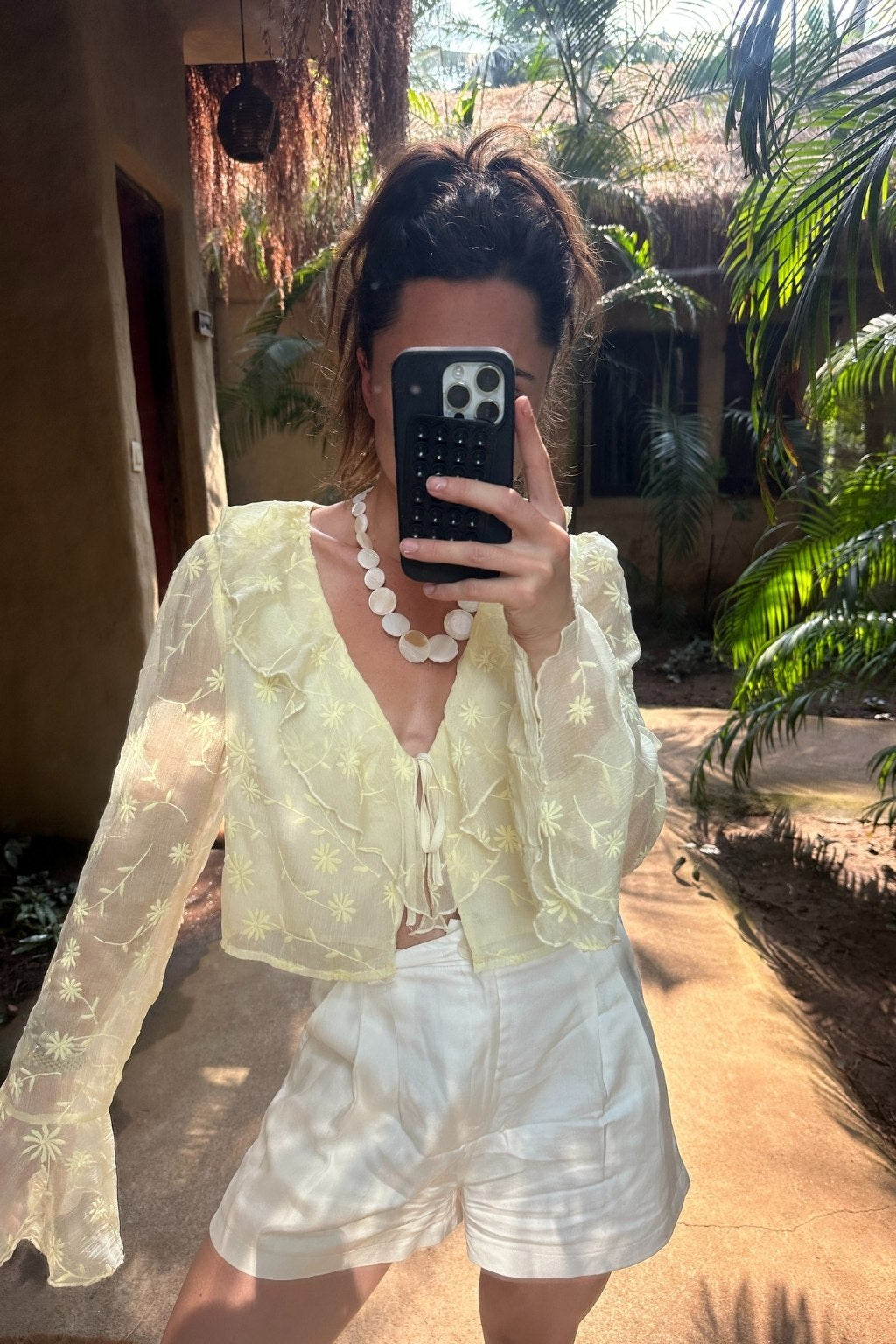 Guilliana Yellow Ruffle Blouse shown in a complementary styling arrangement.