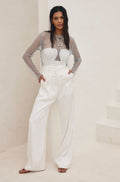 Silver rhinestone top with refined accents, a silver sequin top essential.