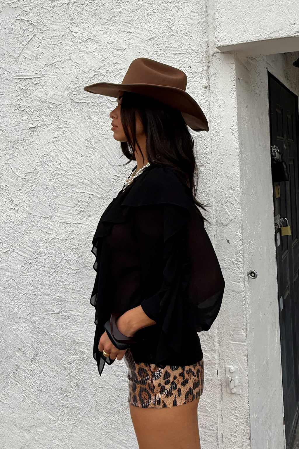 Close-up of the Harlow Black Ruffle Blouse showcasing the fabric texture and design details.