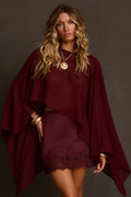 Chiffon cape top in mulberry with flowing poncho silhouette, styled with matching satin mini skirt