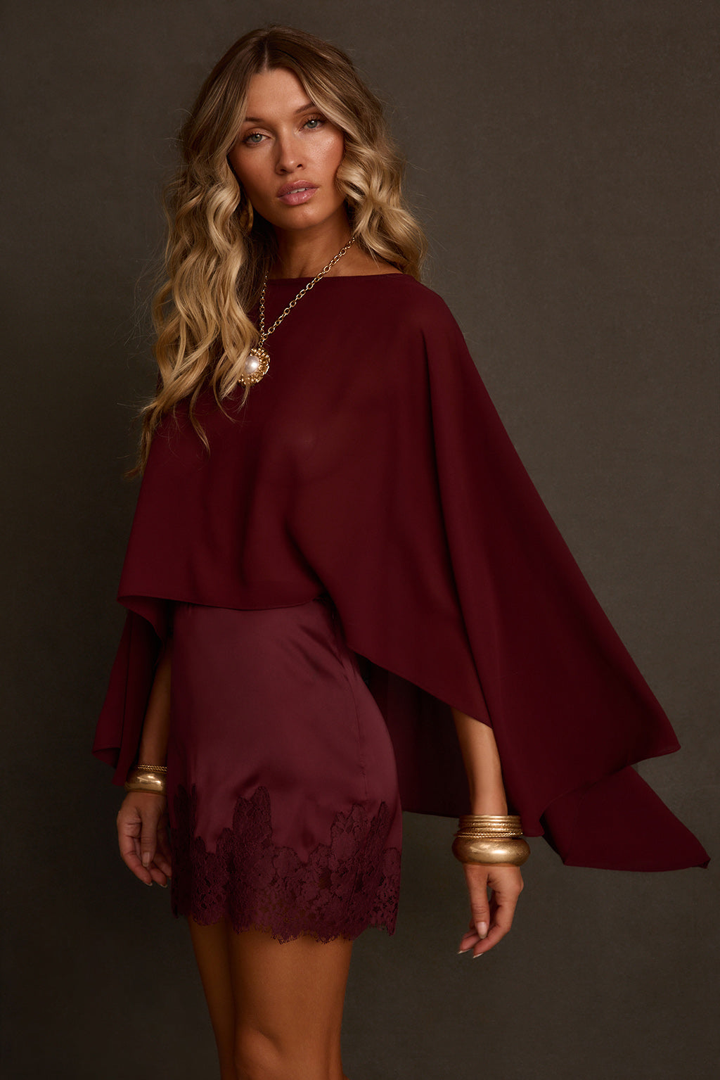 Fall blouse back view showing open cape construction and mulberry chiffon drape