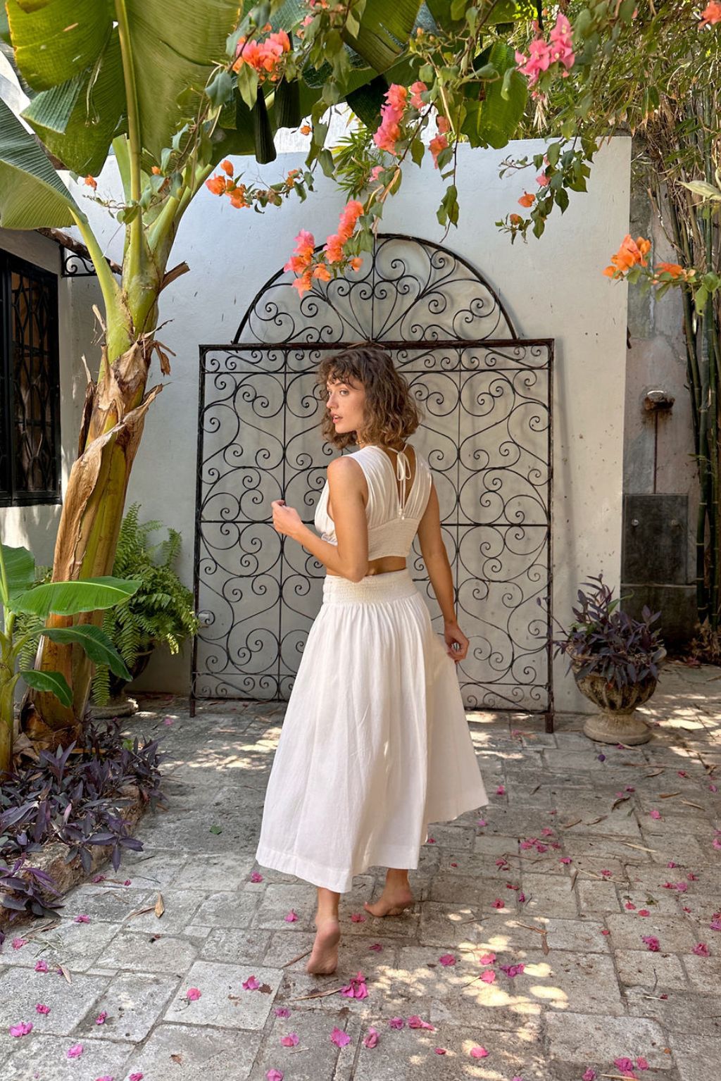 Back view of the white maxi skirt showing the silhouette and fit.