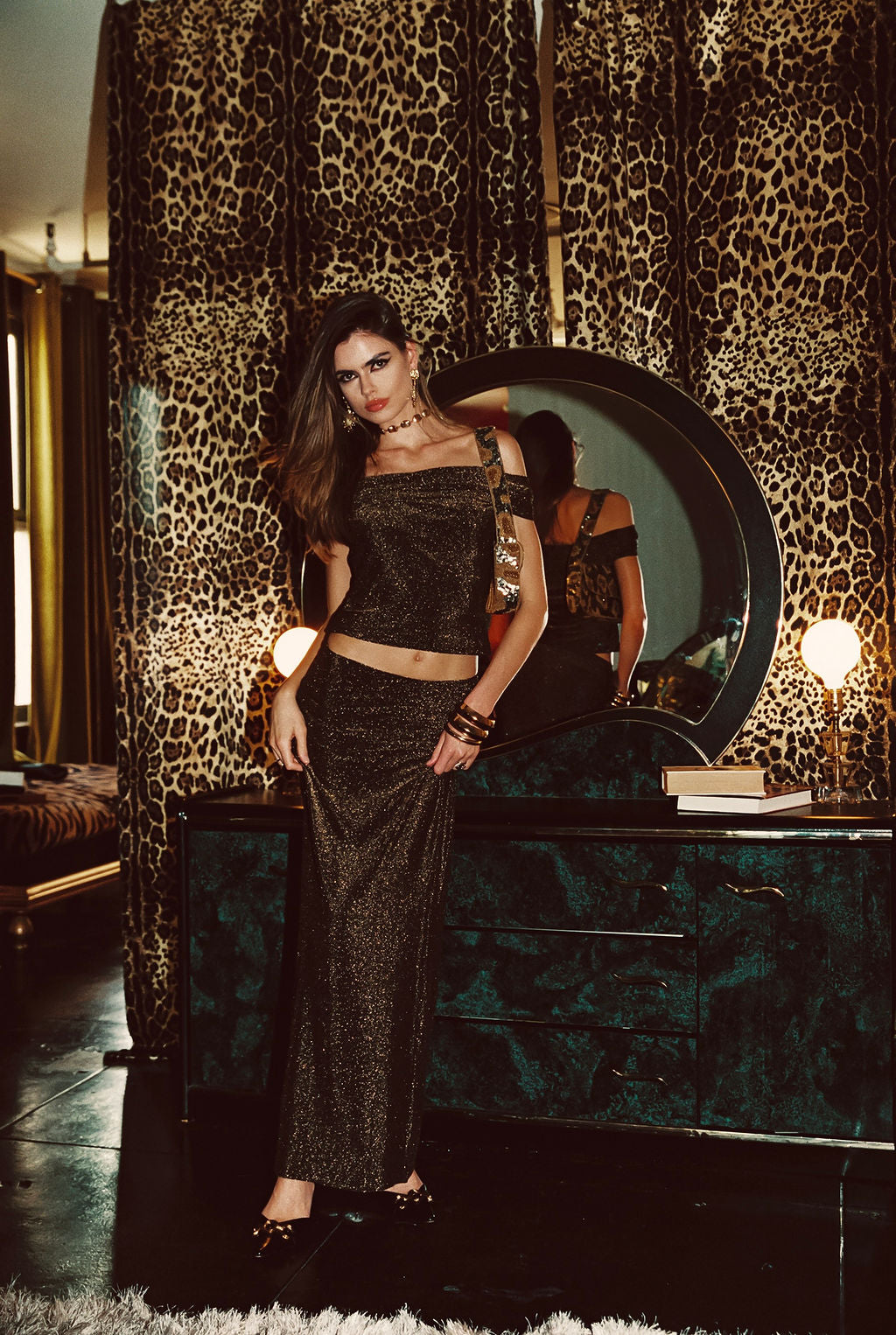 Close-up of the Hypnotized Gold Lurex Off The Shoulder Top showcasing the fabric texture and design details.