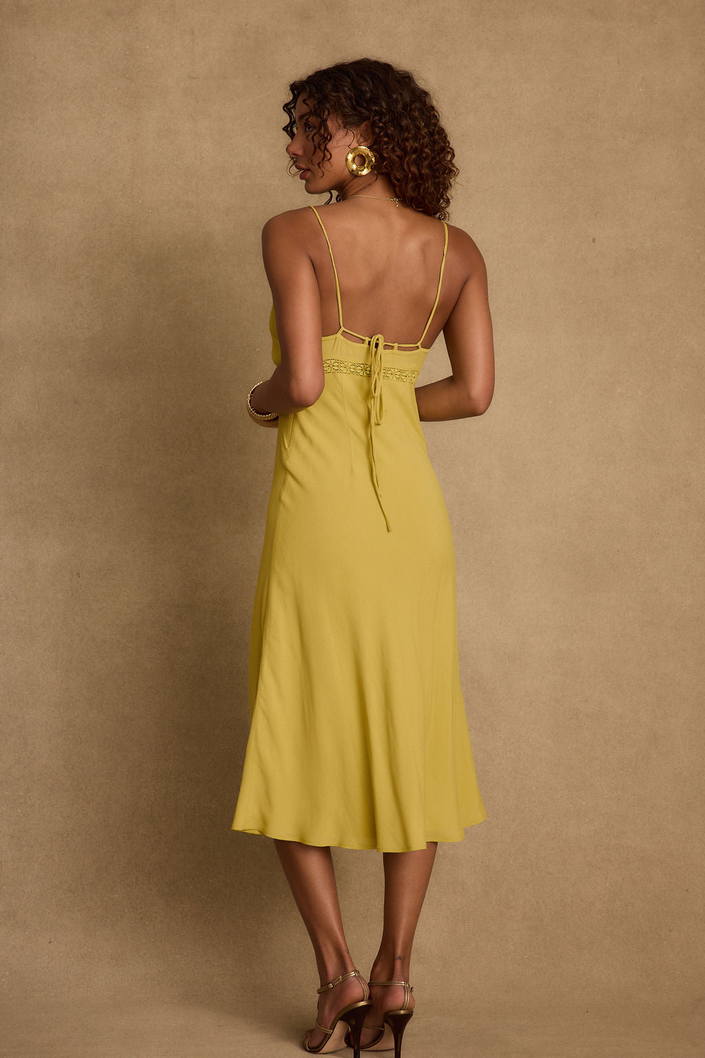 Back view of the midi dress showing the silhouette and fit.