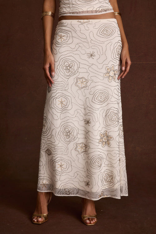 Back view of the white beaded maxi skirt showing the silhouette and fit.