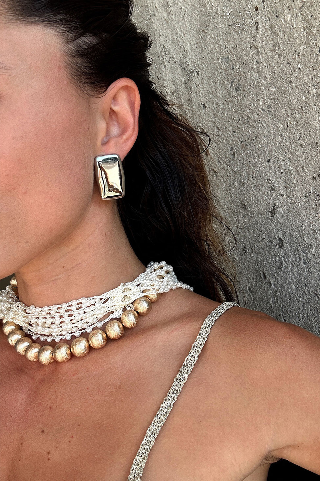 Jensen Hammered Silver Statement Earrings shown from a different angle, highlighting the metalwork details.