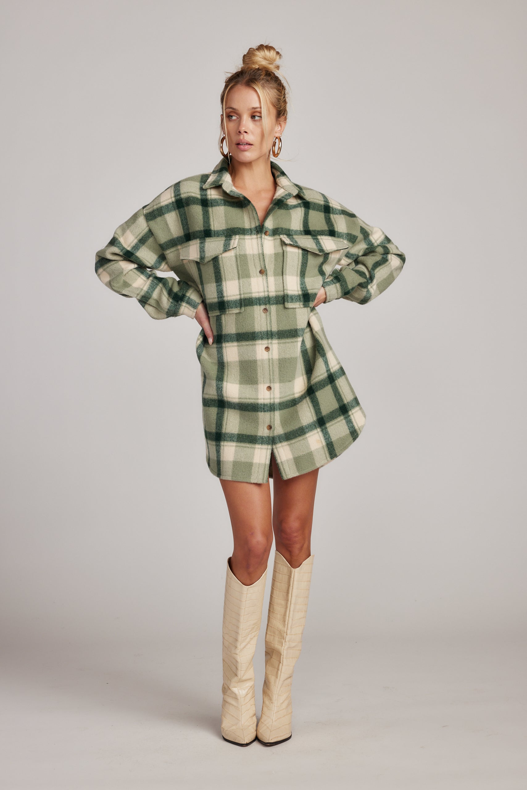 Kellan Emerald Plaid Mini Dress paired with complementary accessories for a polished look.