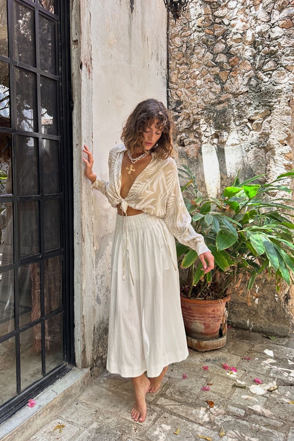 Close-up of the Kiana Beige Palm Print Wrap Top showcasing the fabric texture and design details.