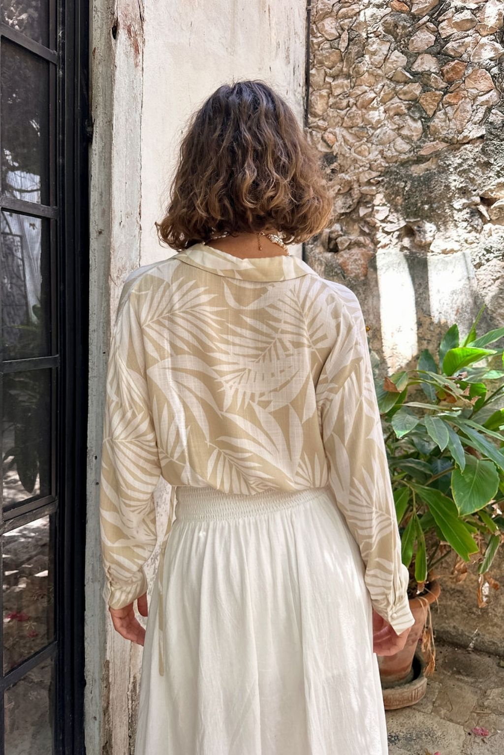 Kiana Beige Palm Print Wrap Top styled in a complete look from an alternate angle.