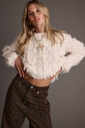 Beige fringe sweater with refined detailing and a flattering silhouette.
