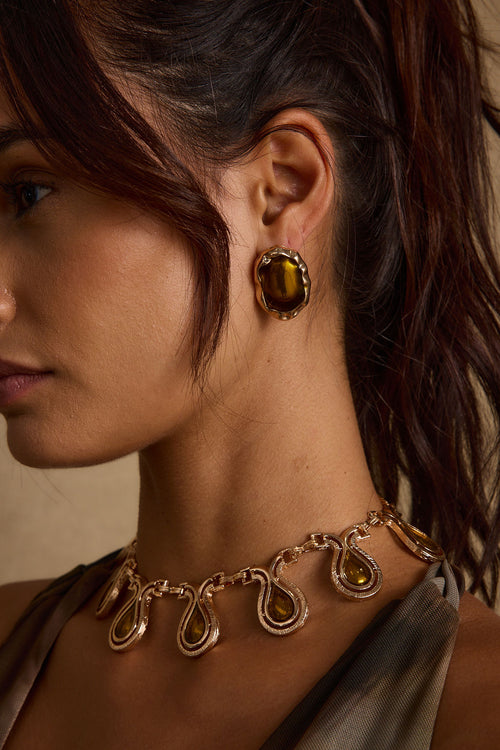Lumira Stone Earrings shown from a different angle, highlighting the metalwork details.