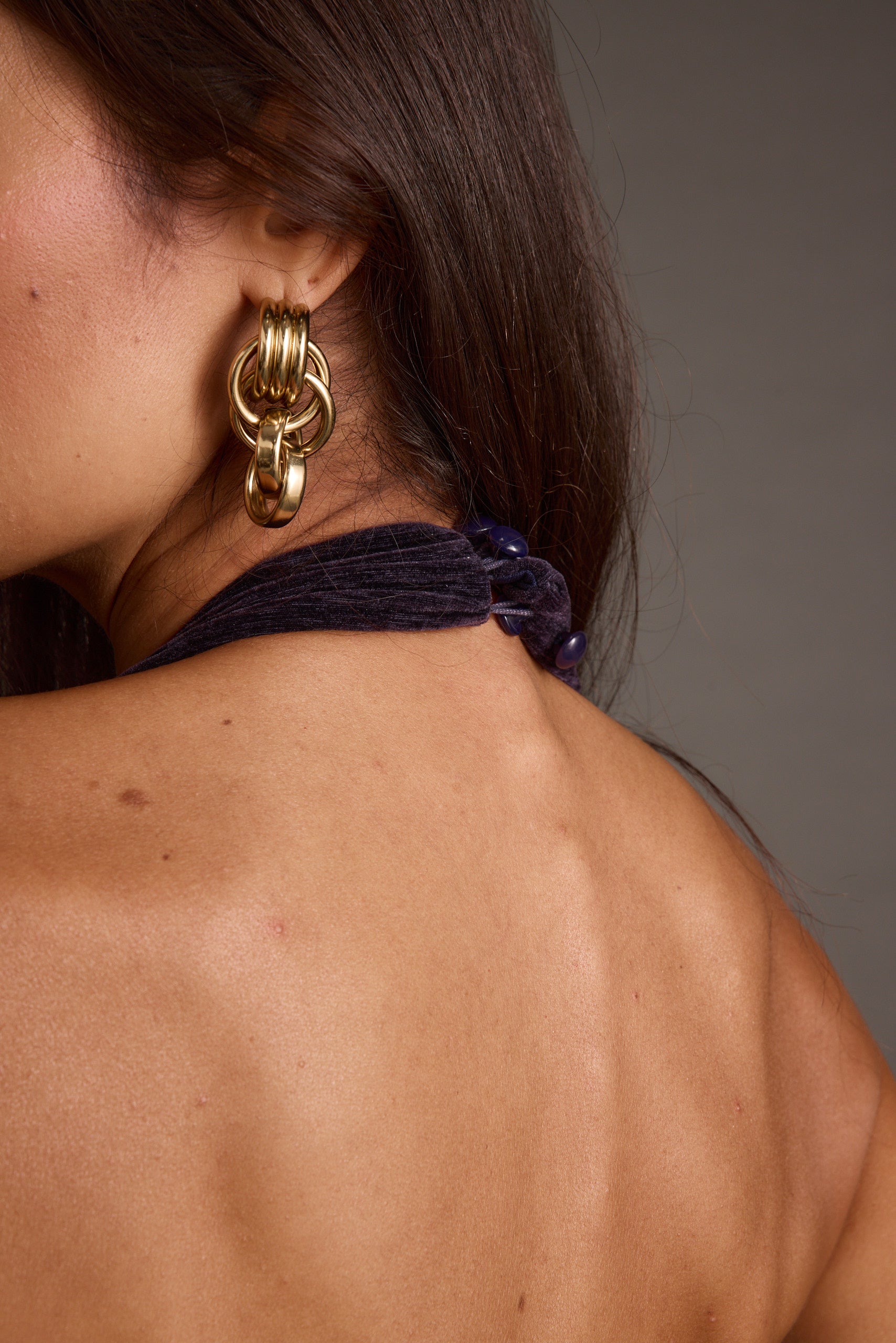 Product view of the Limelight Midnight Velvet Halter Jumpsuit showcasing versatility and wearability.