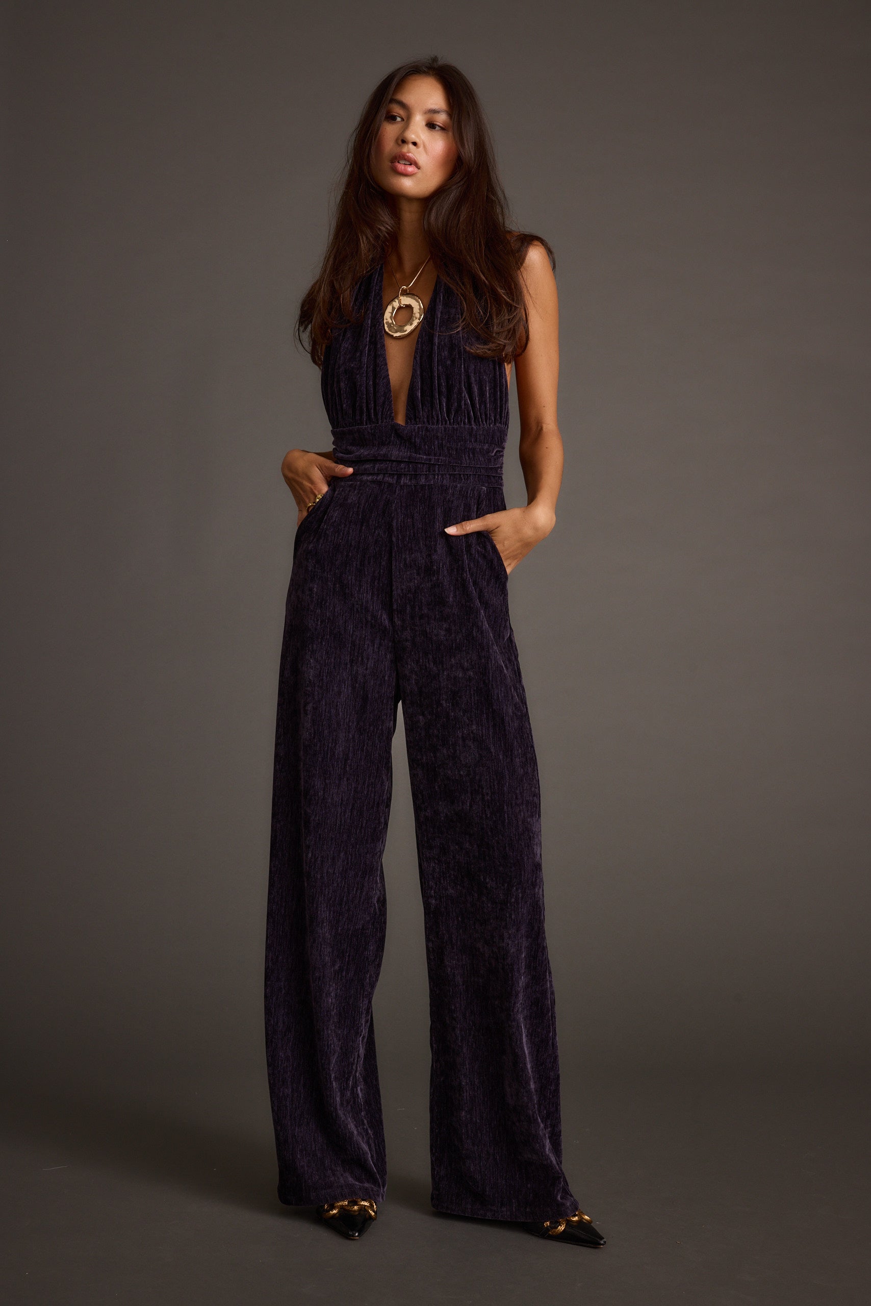 Alternate angle of the jumpsuit highlighting the overall design.