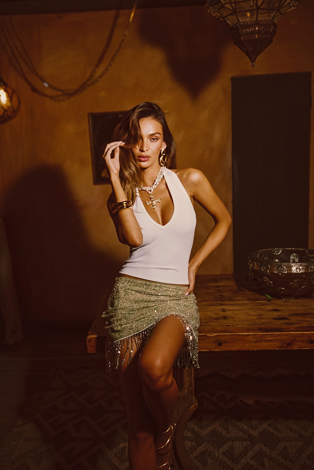 Luna Cove Sage Fringe Mini Skirt shown in a complementary styling arrangement.