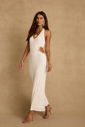 Full-length Luna Del Mar white maxi dress with shell-trimmed side cutout, styled with strappy heels.