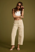 Beige jeans with refined detailing and a flattering silhouette.