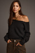 Black sweater with refined detailing and a flattering silhouette.