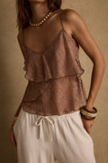 Ruffled piece with refined detailing and a flattering silhouette.