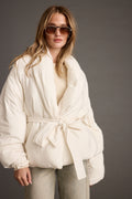White jacket with refined detailing and a flattering silhouette.