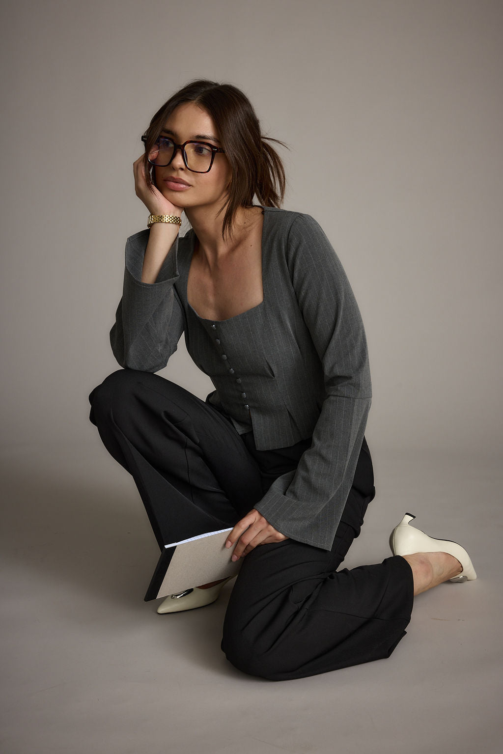 Lifestyle shot of the top styled for day-to-night versatility.