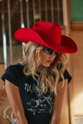 Red cowboy hat with elegant accents, a red cowgirl hat essential.