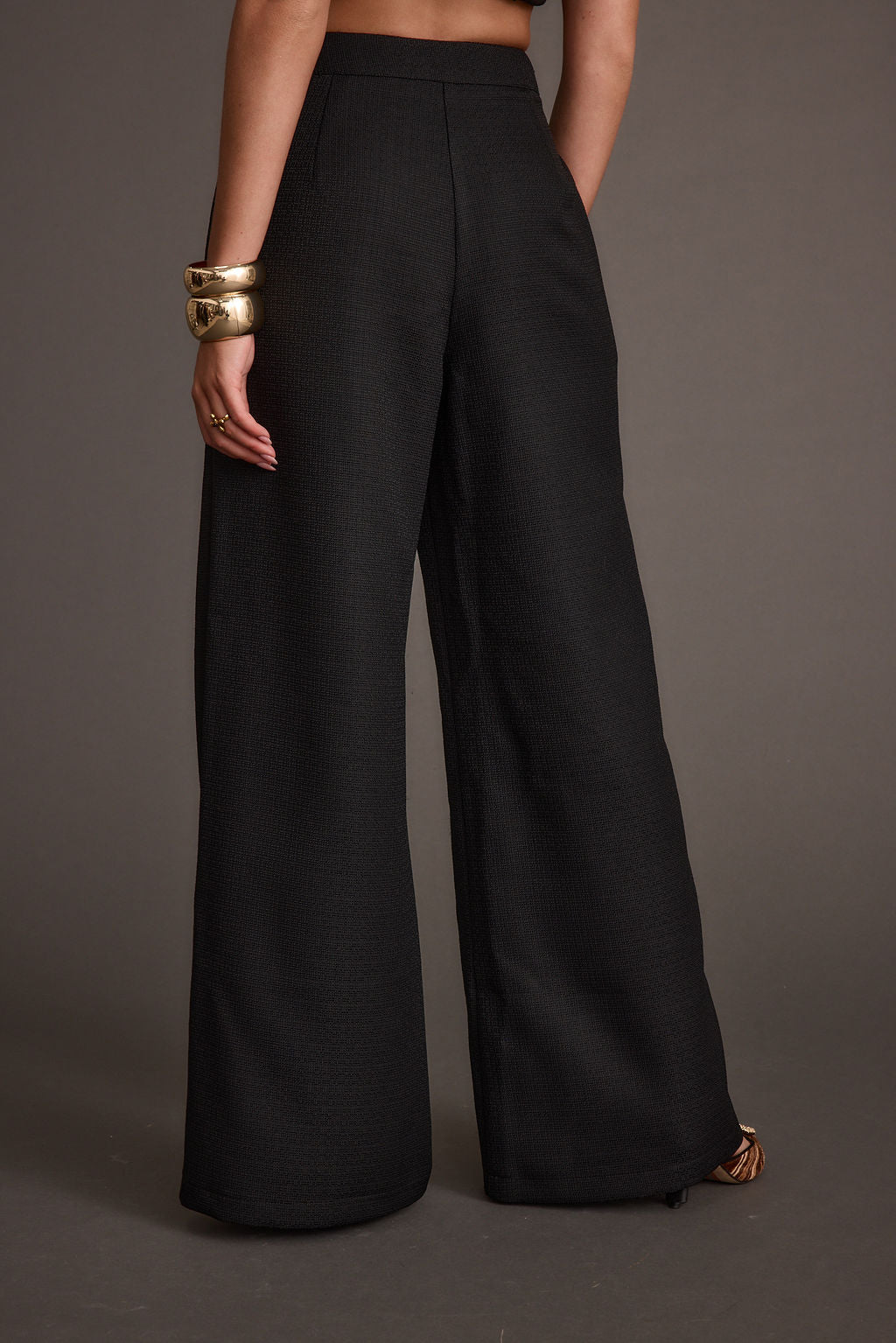 Montague Black Tailored Trousers paired with complementary accessories for a polished look.