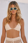 Crochet top with refined accents, a festival tops standout.
