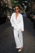 White satin blazer with refined accents, a white satin pants standout.