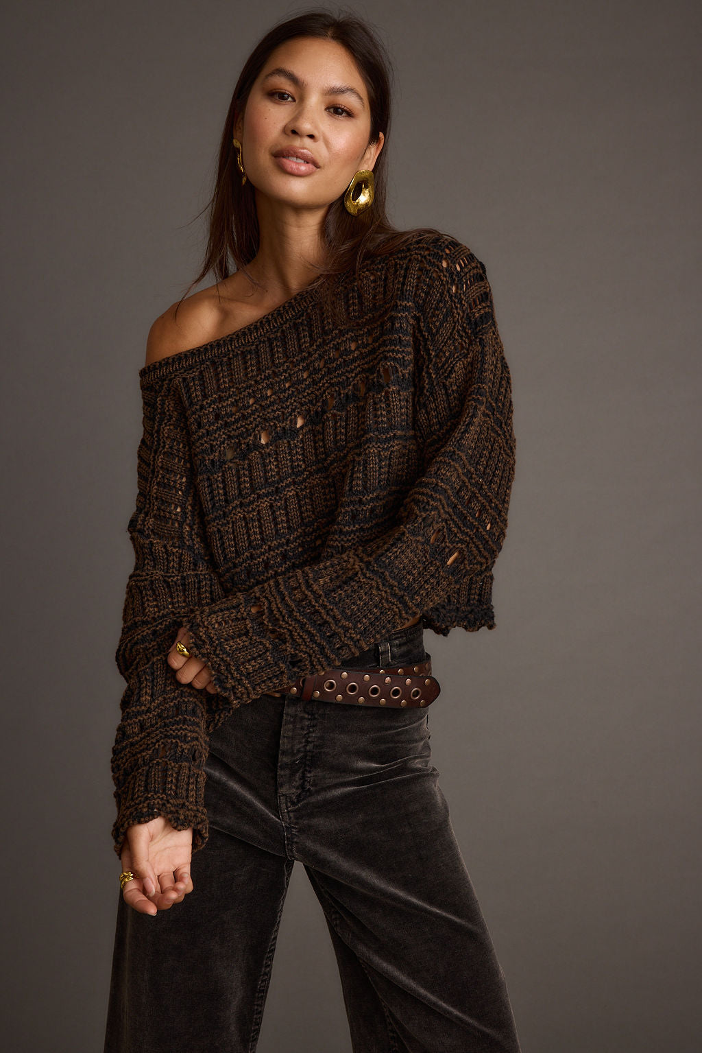 Brown knit sweater with knit detailing and a flattering silhouette.