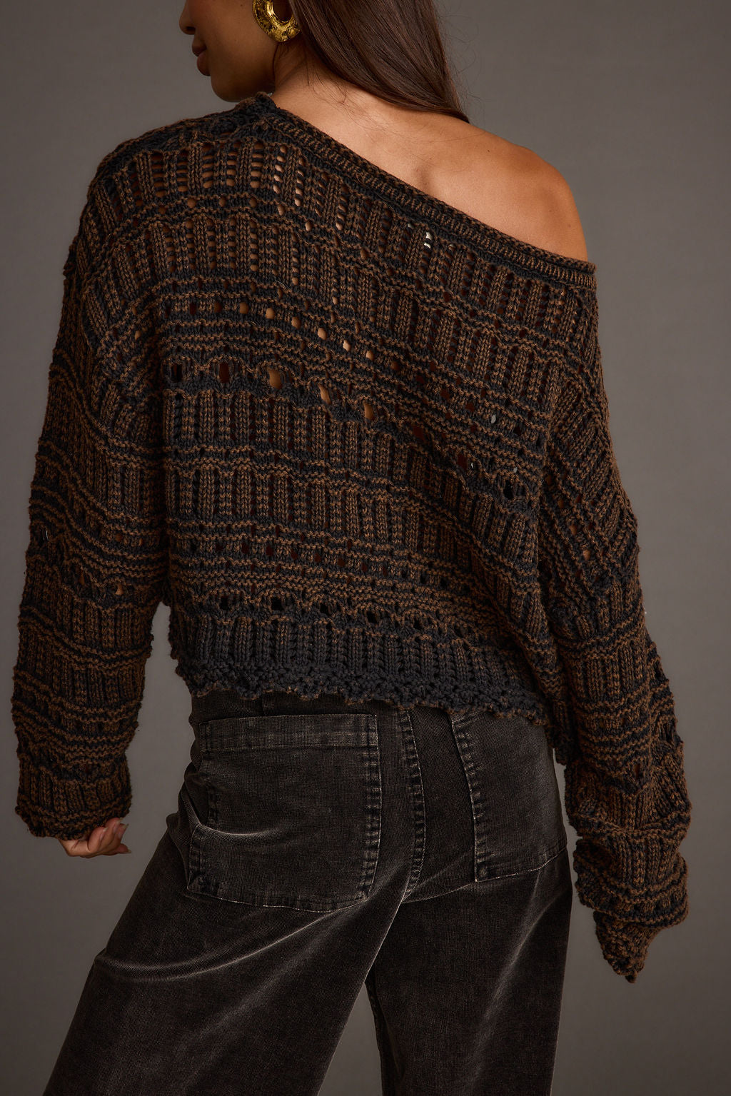 Back view of the brown knit sweater showing the silhouette and fit.