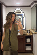 Olive blazer with refined detailing and a flattering silhouette.
